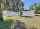 Charming single-story home with a well-maintained lawn and modern exterior at 43 Lake Court Loop, Ocala, FL 34472