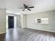 Spacious living room features new flooring and an open layout to the kitchen at 43 Lake Court Loop, Ocala, FL 34472