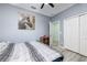 Cozy bedroom featuring neutral tones, a comfortable bed, and ample storage space, creating a relaxing retreat at 4313 Gumbo Limbo Dr, Orlando, FL 32822