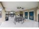 Community area with covered tables, chairs, and ceiling fans for socializing and relaxation at 4313 Gumbo Limbo Dr, Orlando, FL 32822
