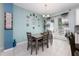 Dining room with neutral paint, decor, modern table set, and large window for plenty of natural light at 4313 Gumbo Limbo Dr, Orlando, FL 32822