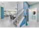 Open-concept home with view of the staircase, dining area, kitchen, living room, and a glimpse into the bathroom at 4313 Gumbo Limbo Dr, Orlando, FL 32822