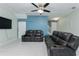 Cozy living room with comfortable seating, ceiling fan, and stylish decor, creating a relaxing space at 4313 Gumbo Limbo Dr, Orlando, FL 32822