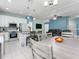Bright, open floor plan connecting kitchen and living space, featuring modern finishes and ample natural light at 4313 Gumbo Limbo Dr, Orlando, FL 32822