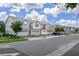 Scenic street view showcasing well-maintained homes with manicured lawns and mature trees, creating a welcoming neighborhood at 4313 Gumbo Limbo Dr, Orlando, FL 32822