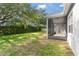 A well maintained lawn surrounding a home with a screened lanai at 4520 Barrister Dr, Clermont, FL 34711