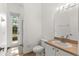 Bright bathroom featuring white fixtures, vanity, and natural lighting at 4520 Barrister Dr, Clermont, FL 34711