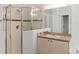 Bathroom showcasing glass-enclosed shower and vanity with wood countertop at 4520 Barrister Dr, Clermont, FL 34711