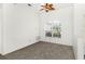 Bedroom with carpeted floors, neutral walls, and natural light from the window at 4520 Barrister Dr, Clermont, FL 34711