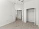 Neutral bedroom with doors to closet and ensuite bathroom at 4520 Barrister Dr, Clermont, FL 34711