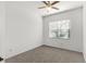 Neutral bedroom showcasing a fan and large window providing ample natural light at 4520 Barrister Dr, Clermont, FL 34711