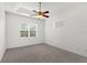 Bedroom featuring neutral carpet, ceiling fan and a window with blinds at 4520 Barrister Dr, Clermont, FL 34711