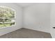 Neutral bedroom with large window providing abundant natural light at 4520 Barrister Dr, Clermont, FL 34711