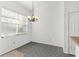 Dining area with tile flooring, chandelier and natural light from a window at 4520 Barrister Dr, Clermont, FL 34711