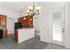 Open kitchen area with dark appliances and a breakfast bar overlooking a dinette at 4520 Barrister Dr, Clermont, FL 34711