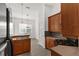 Well-lit kitchen with breakfast nook, wood cabinetry, and tile flooring at 4520 Barrister Dr, Clermont, FL 34711