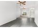Living room with neutral paint, a ceiling fan, tile flooring, and a large window at 4520 Barrister Dr, Clermont, FL 34711