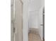 Tile shower with glass doors, with a glimpse into the adjacent bedroom at 4520 Barrister Dr, Clermont, FL 34711