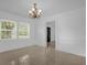 Open dining room area featuring tile floors, natural light, and access to other rooms at 490 Shoreview Ave, Winter Park, FL 32789