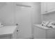A clean laundry area is displayed with appliances, offering functionality and convenience for household chores at 490 Shoreview Ave, Winter Park, FL 32789