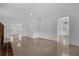Bright living room featuring neutral walls, tile flooring and doorways leading to other rooms at 490 Shoreview Ave, Winter Park, FL 32789