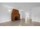 Bright living room featuring brick fireplace, neutral walls, and tile flooring at 490 Shoreview Ave, Winter Park, FL 32789