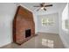 Living room featuring a brick fireplace, ceiling fan, and neutral paint at 490 Shoreview Ave, Winter Park, FL 32789