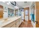 Bright bathroom with double sink vanity, ample lighting, tiled floor, and a shower/tub combo at 513 Sabal Trail Cir, Longwood, FL 32779