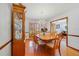 Formal dining room with hardwood floors, chandelier, and built-in display cabinet at 513 Sabal Trail Cir, Longwood, FL 32779