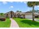 Charming single-Gathering home with brick accents, lush lawn, and a curved brick walkway leading to the front door at 513 Sabal Trail Cir, Longwood, FL 32779