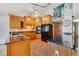 Well-appointed kitchen with tile floors, granite countertops, and stainless steel appliances at 513 Sabal Trail Cir, Longwood, FL 32779