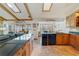 Open kitchen featuring granite countertops, custom cabinets, and views of the pool and breakfast nook at 513 Sabal Trail Cir, Longwood, FL 32779