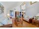 Spacious living room with high ceilings, wood floors, and stylish decor at 513 Sabal Trail Cir, Longwood, FL 32779