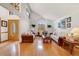 Bright living room with vaulted ceilings, wood floors, and ample seating at 513 Sabal Trail Cir, Longwood, FL 32779