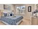Bright bedroom with a queen-sized bed, a large window and tasteful decor and furniture at 5169 Masser Rd, St Cloud, FL 34772