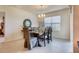 Elegant dining area with a large wooden table, upholstered chairs, and a decorative mirror at 5169 Masser Rd, St Cloud, FL 34772