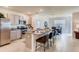 Modern kitchen with a granite countertop island, stainless steel appliances and a dining area at 5169 Masser Rd, St Cloud, FL 34772