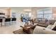 Open concept living space with modern furniture, stainless steel appliances, and a dining area at 5169 Masser Rd, St Cloud, FL 34772