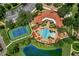 Aerial view of community pool, tennis court, and clubhouse at 524 Lobelia Dr, Lake Mary, FL 32746
