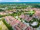 Aerial view showcasing a sprawling residential community with lakes, lush greenery, and well-maintained landscaping at 524 Lobelia Dr, Lake Mary, FL 32746