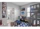 Charming bedroom showcasing a bunk bed, musical instruments, and a view into an adjacent bathroom at 524 Lobelia Dr, Lake Mary, FL 32746