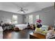 Bright and spacious bedroom with two beds, a ceiling fan, and two desks for study at 524 Lobelia Dr, Lake Mary, FL 32746