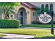 Inviting Fountain Parke clubhouse entrance, surrounded by manicured landscaping and mature trees at 524 Lobelia Dr, Lake Mary, FL 32746