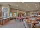 Large clubhouse with a pool table, multiple seating areas, and kitchen at 524 Lobelia Dr, Lake Mary, FL 32746