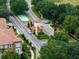 Aerial shot of a gated community entrance with lush landscaping and well-maintained roadways at 524 Lobelia Dr, Lake Mary, FL 32746