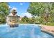 Beautiful tiered fountain with multiple water features, surrounded by greenery and manicured landscaping at 524 Lobelia Dr, Lake Mary, FL 32746
