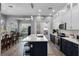 Contemporary kitchen with white and navy cabinetry, a large island, and stainless steel appliances at 524 Lobelia Dr, Lake Mary, FL 32746