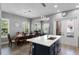 Open-concept kitchen featuring a large island with breakfast bar and adjacent dining area at 524 Lobelia Dr, Lake Mary, FL 32746