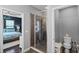 Ensuite bathroom with tiled shower, glass enclosure, and access to the main bedroom and toilet room at 524 Lobelia Dr, Lake Mary, FL 32746