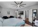 Bright main bedroom with seating area, mounted TV, fireplace, and ensuite bathroom access at 524 Lobelia Dr, Lake Mary, FL 32746